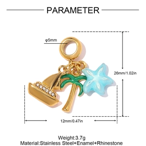 Macro detail of nautical stainless steel charms showing sailboat, palm tree and starfish