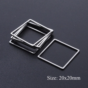 Macro detail of 20x20mm square silver stainless steel geometric frames for DIY jewelry