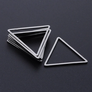 Macro shot of silver stainless steel triangle jump rings for DIY jewelry making