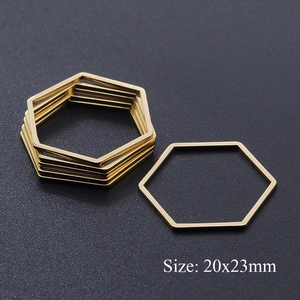 Macro shot of gold stainless steel hexagon charms measuring 20x23mm for DIY jewelry