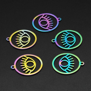 Macro view of five rainbow evil eye pendants in stainless steel on black surface