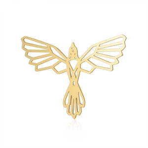 Macro detail of golden geometric bird pendant with cutout lines and polished steel finish
