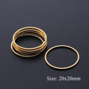 Macro shot of 20x20mm minimalist gold-plated stainless steel circular jewelry charms