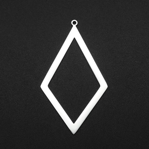 Macro detail of a silver stainless steel hollow diamond geometric charm with loop