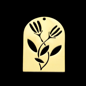 Detail of a hollow gold-plated stainless steel flower pendant with a polished finish