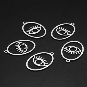Detailed view of five silver stainless steel Turkish evil eye charms for DIY jewelry making