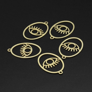 Detail of 5 matte gold evil eye charms in stainless steel for DIY jewelry making