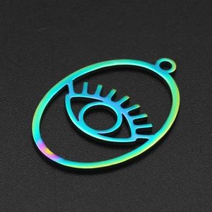 Macro detail of rainbow gradient evil eye pendant in stainless steel for DIY jewelry