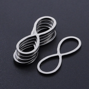 Macro shot of silver infinity shaped stainless steel charms for DIY jewelry making