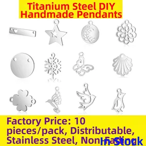 Pack of 10 assorted silver stainless steel charms featuring stars, butterflies and clovers