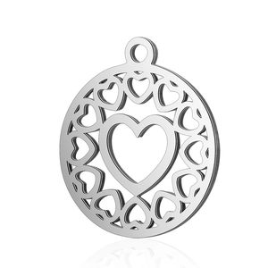 Macro detail of silver stainless steel pendant with hollow heart pattern and bail