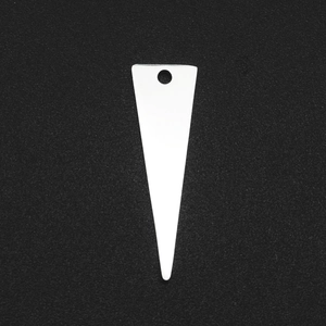 Macro view of white triangular pendant with top hole for DIY jewelry making and crafts