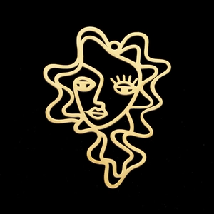 Polished gold stainless steel abstract face pendant with artistic Picasso-style line art