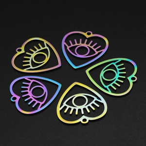 Macro view of five rainbow heart-shaped evil eye pendants for DIY stainless steel jewelry