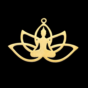 Macro detail of a golden stainless steel pendant featuring Buddha silhouette and lotus petals