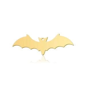 Detailed macro view of a bat-shaped gold titanium steel pendant for jewelry DIY
