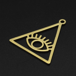 Detailed close-up of a golden stainless steel evil eye triangle pendant for DIY jewelry