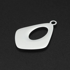 Macro view of geometric stainless steel pendant with oval cutout for DIY jewelry making