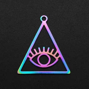 Macro detail of a rainbow triangular evil eye pendant charm in polished stainless steel