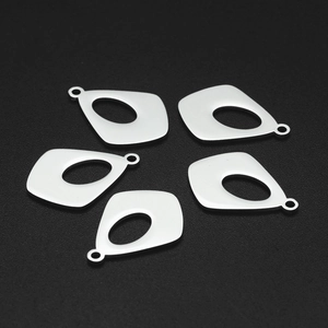 Five geometric stainless steel hollow drop pendants with matte finish on black background
