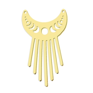 Detailed view of bohemian gold crescent moon pendant with dangling metallic tassel fringe