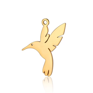 Detailed view of polished golden hummingbird charm made of durable stainless steel