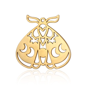 Macro detail of gold butterfly wing pendant with hollow heart and moon crescent design