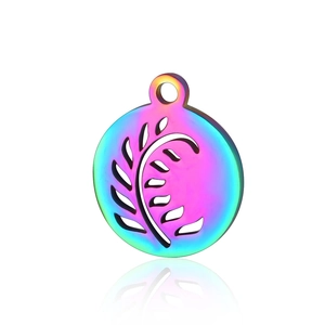 Macro detail of rainbow plated stainless steel round pendant with leaf cutout design