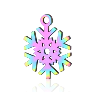 Macro detail of snowflake-shaped stainless steel pendant with rainbow plating and hanging ring
