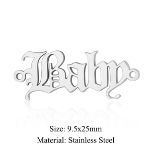 Macro detail of gothic Baby letter connector pendant in polished stainless steel