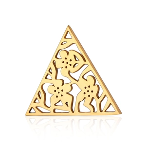 Detailed view of triangular gold hollow pendant with floral and figure engraving patterns