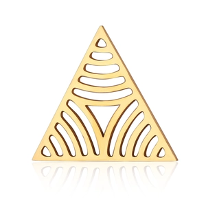 Close-up of golden geometric triangle pendant with intricate hollow-out floral patterns