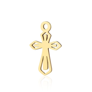 Macro shot of gold stainless steel hollow cross pendant with mirror reflection