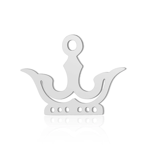 Detailed macro view of polished stainless steel crown pendant with intricate hollow cutouts