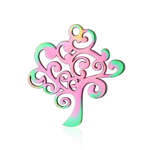 Detailed macro of a rainbow plated tree of life pendant with intricate hollow design