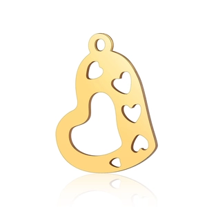 Macro shot of gold stainless steel heart pendant with multiple cutouts and smooth finish