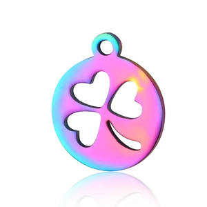Macro detail of rainbow plated stainless steel clover pendant with reflective finish