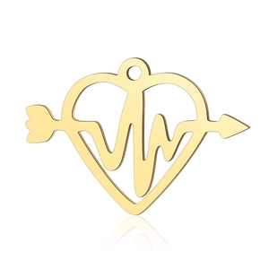Macro shot of gold heart arrow pendant with ECG heartbeat line and polished finish