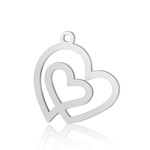 Macro detail of overlapping double heart stainless steel pendant with polished finish