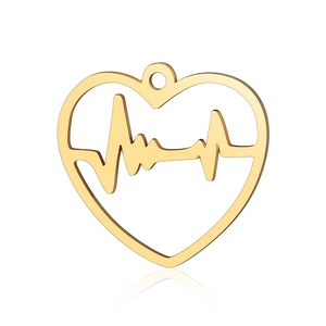 Macro detail of golden hollow heart pendant featuring EKG heartbeat lines and polished finish