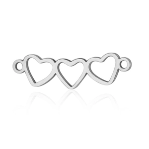 Macro detail of three interlinked silver heart connectors for DIY jewelry making