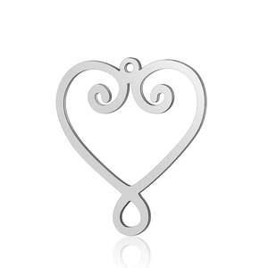Macro shot of stainless steel heart pendant with scroll texture for DIY jewelry making