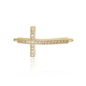 Detail of gold cross jewelry connector with inlaid white cubic zirconia and dual loop rings