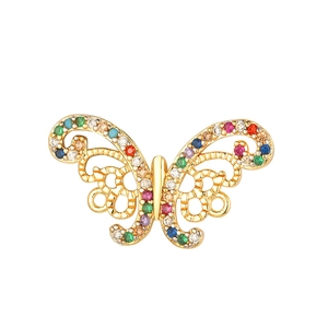 Close-up of golden butterfly charm with rainbow cubic zirconia and hollow design