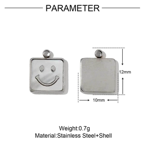 Macro detail of square stainless steel smiley face pendant with white shell inlay
