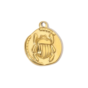 Detailed view of a vintage gold scarab beetle pendant with rustic textured edges