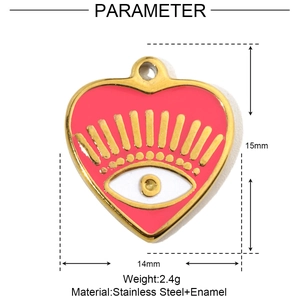 Detail of red enamel heart charm with eye design in gold stainless steel frame