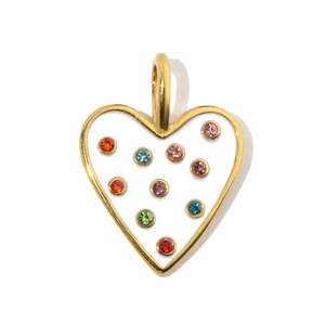 Macro shot of gold heart pendant with colorful rhinestones on white enamel finish
