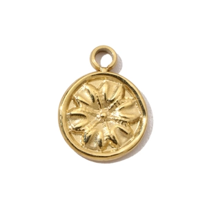 Detail of golden stainless steel sunflower charm with textured sunburst relief for DIY jewelry