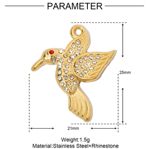 Macro detail of a gold stainless steel hummingbird pendant with sparkling rhinestones